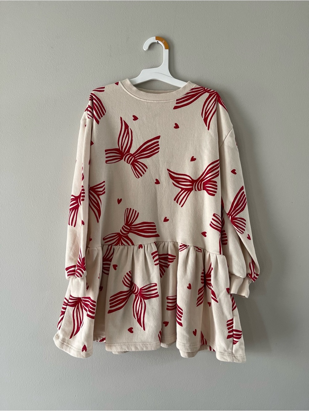 H&M Cream Peplum Dress with Red Bow Print